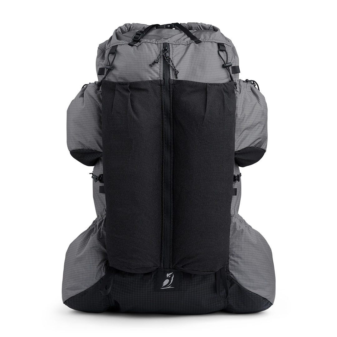 Front view of the Shadowlight 60 ultralight backpack with large external mesh pocket and roll-top closure system.